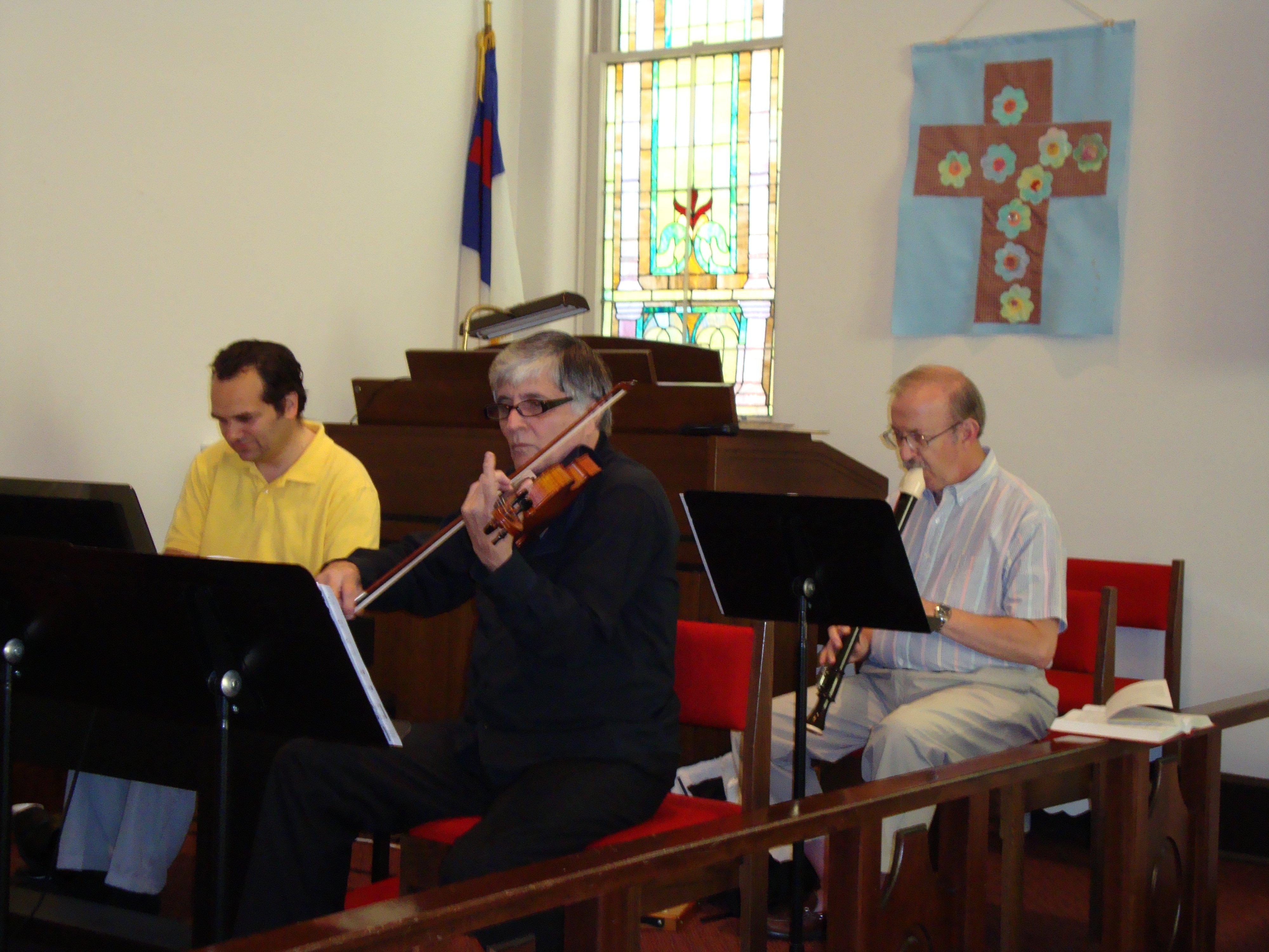 George Karst, Gino Agresti and Charles Rader prepare for Folk serive.