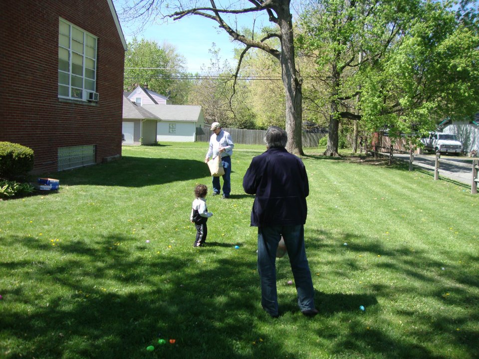 Rich Sceniak and Gino Agresti hide the eggs on April 7, 2012. Bunny Sara Jacobs watches.