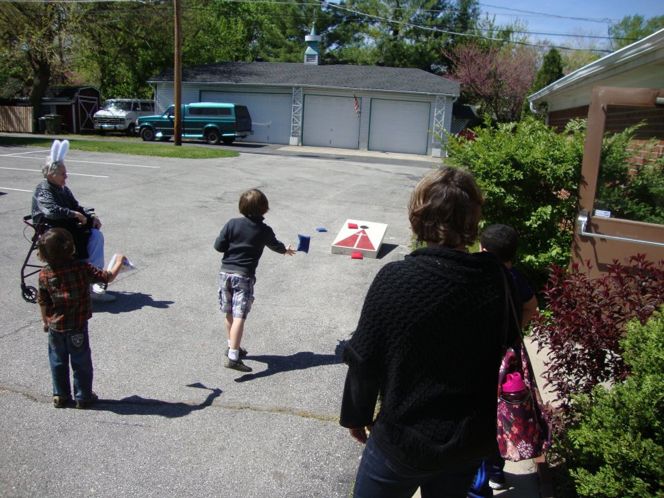 Tossing the bean bags outside the Fellowship Hall on April 7, 2012. Bunny Sara Jacobs watches.
